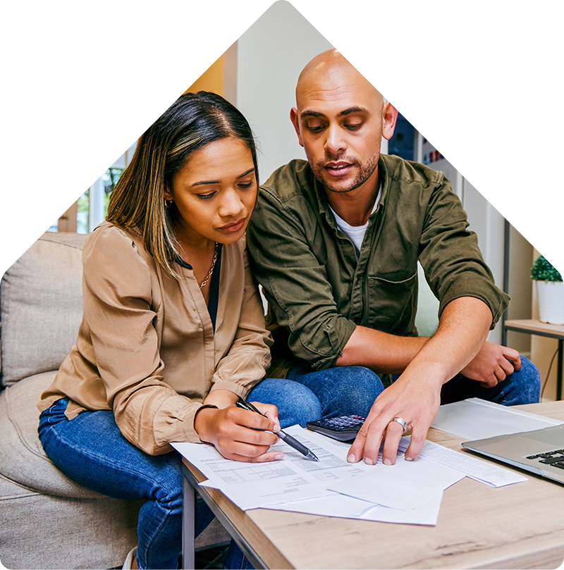 Couple doing paperwork at home